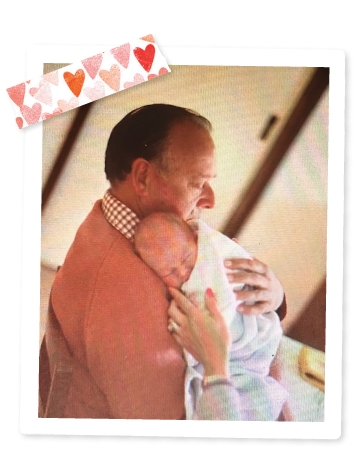 Gifts in Wills supporter, Pam, being held as a baby by her late father